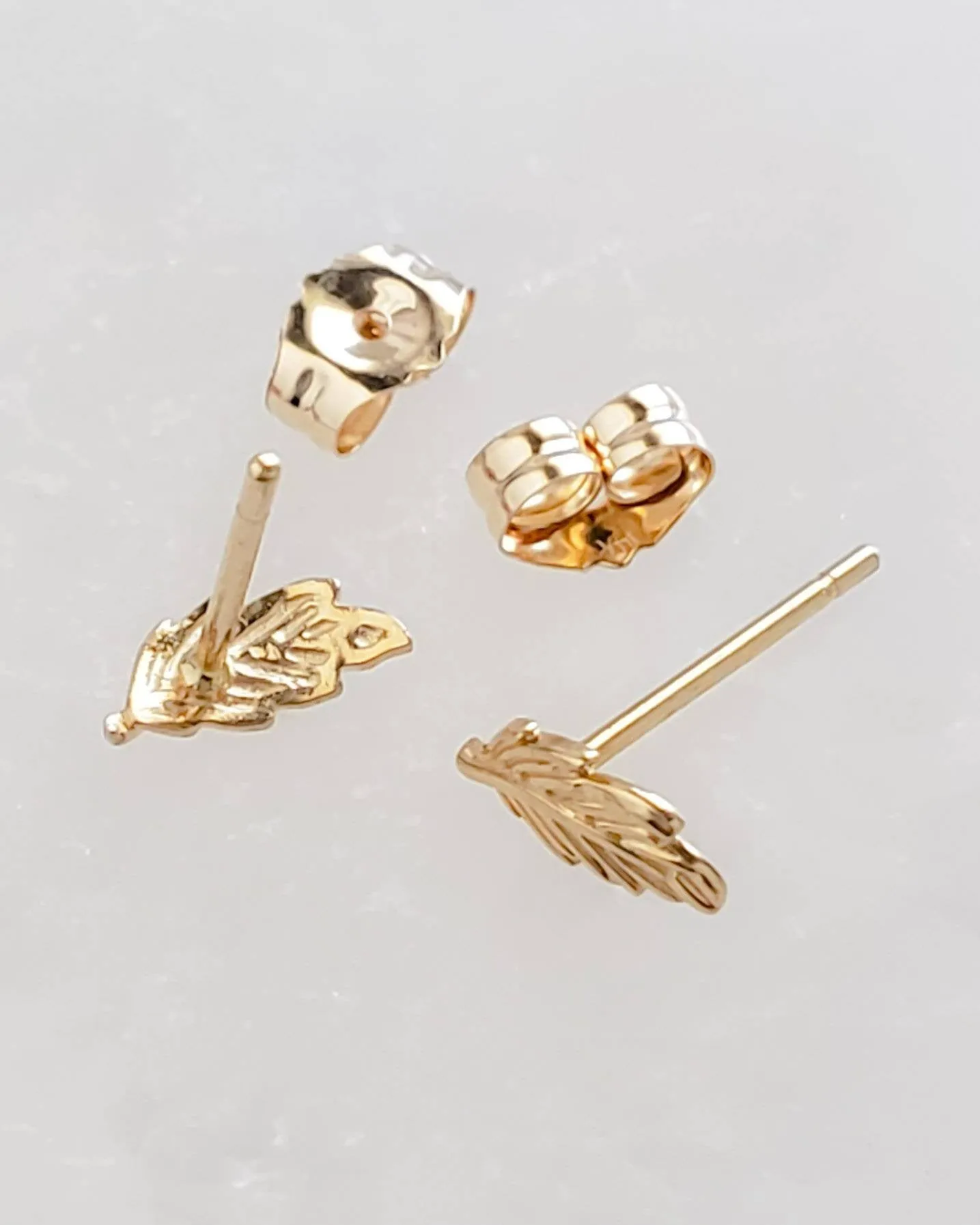 Delicate Feather Studs in 14K Gold