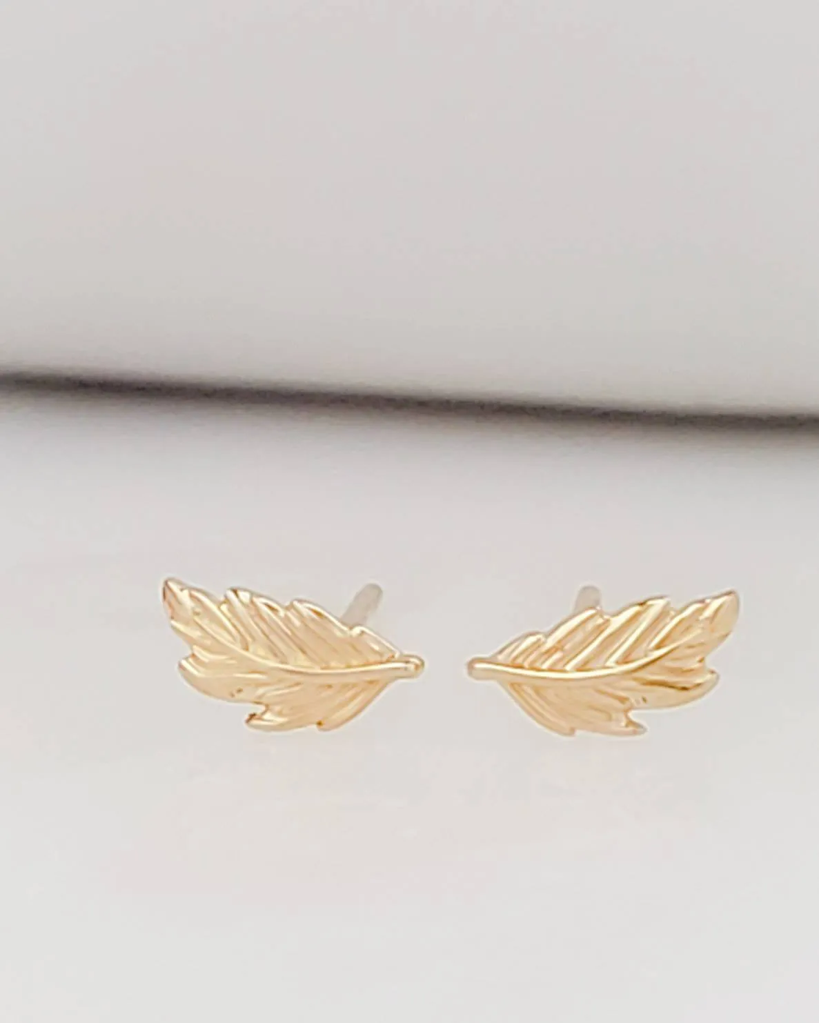 Delicate Feather Studs in 14K Gold