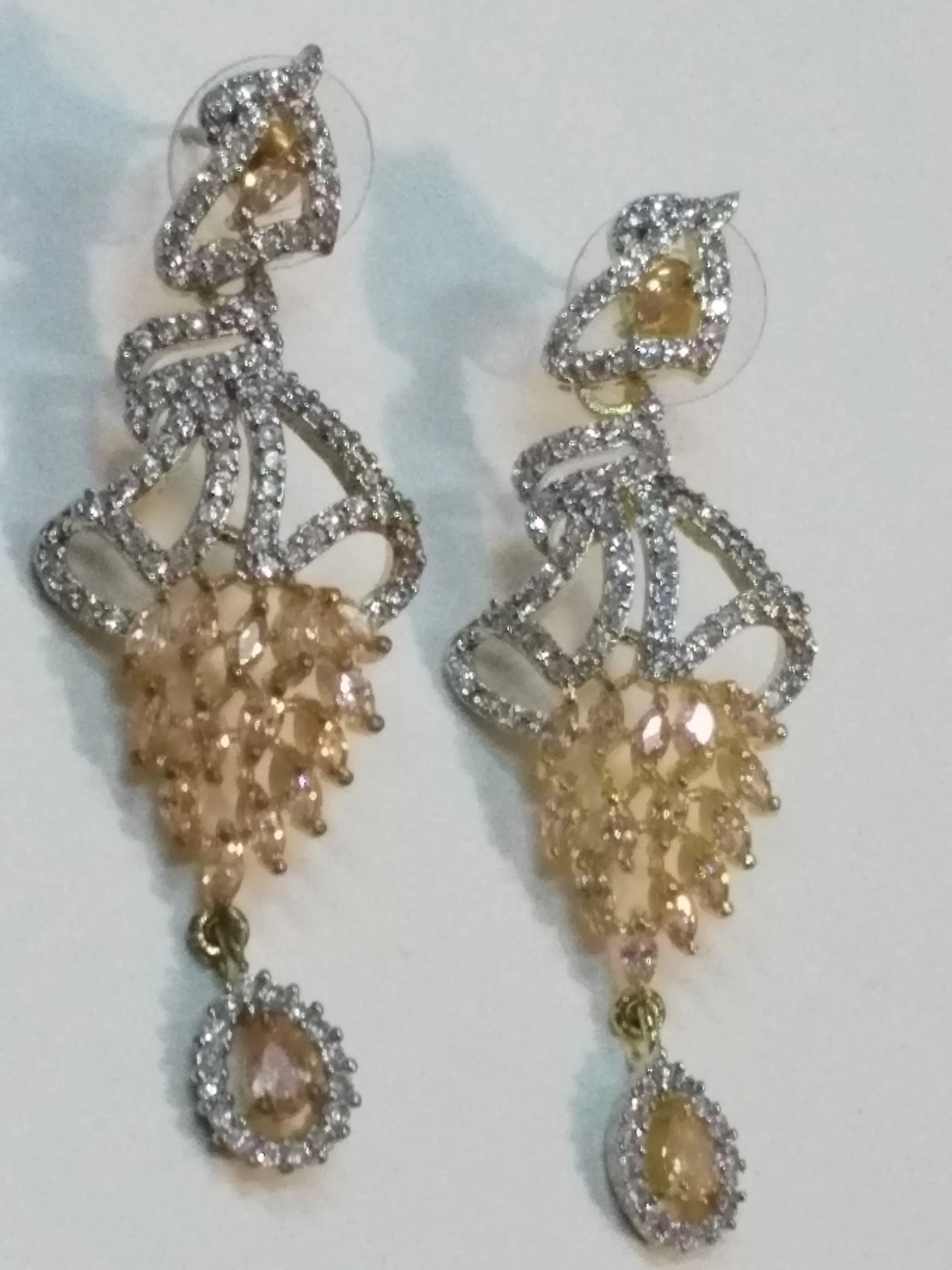 Inverted feather style pink stones earrings