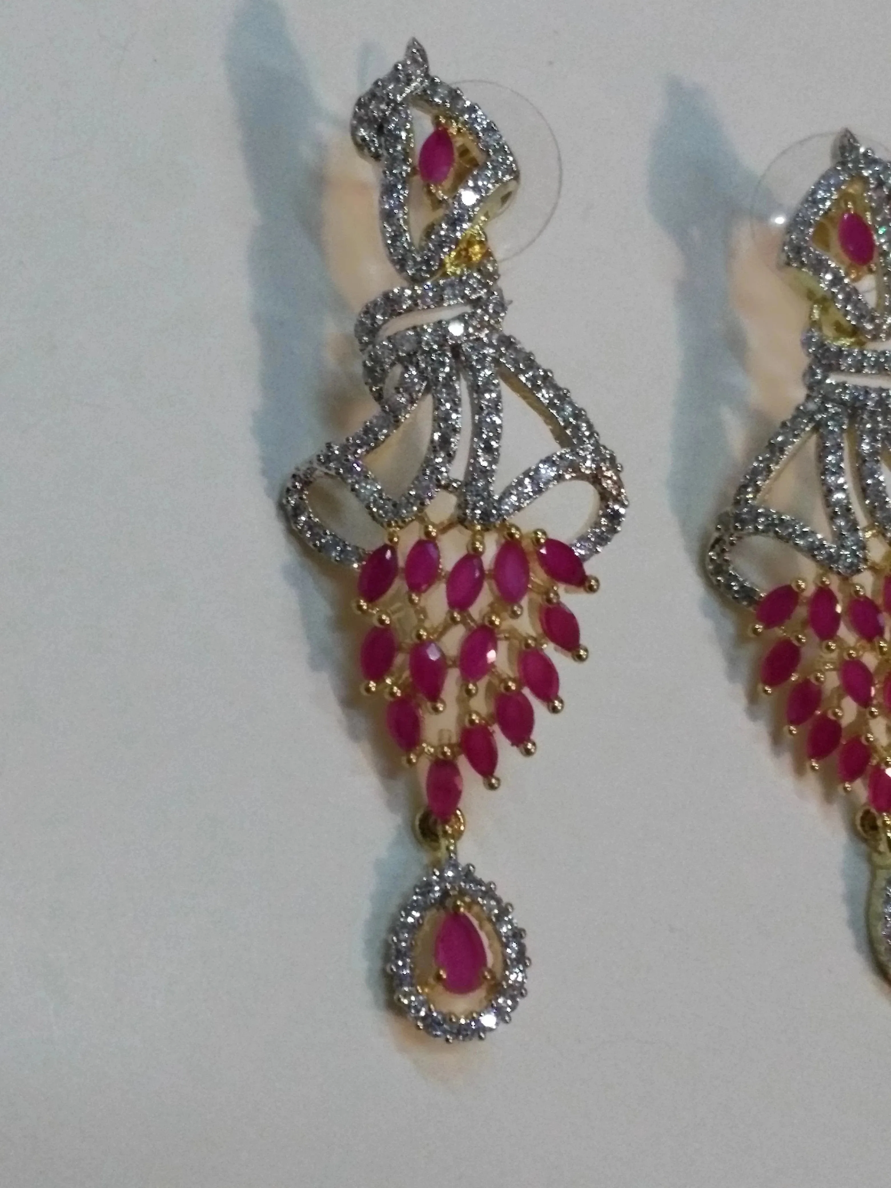 Inverted feather style pink stones earrings