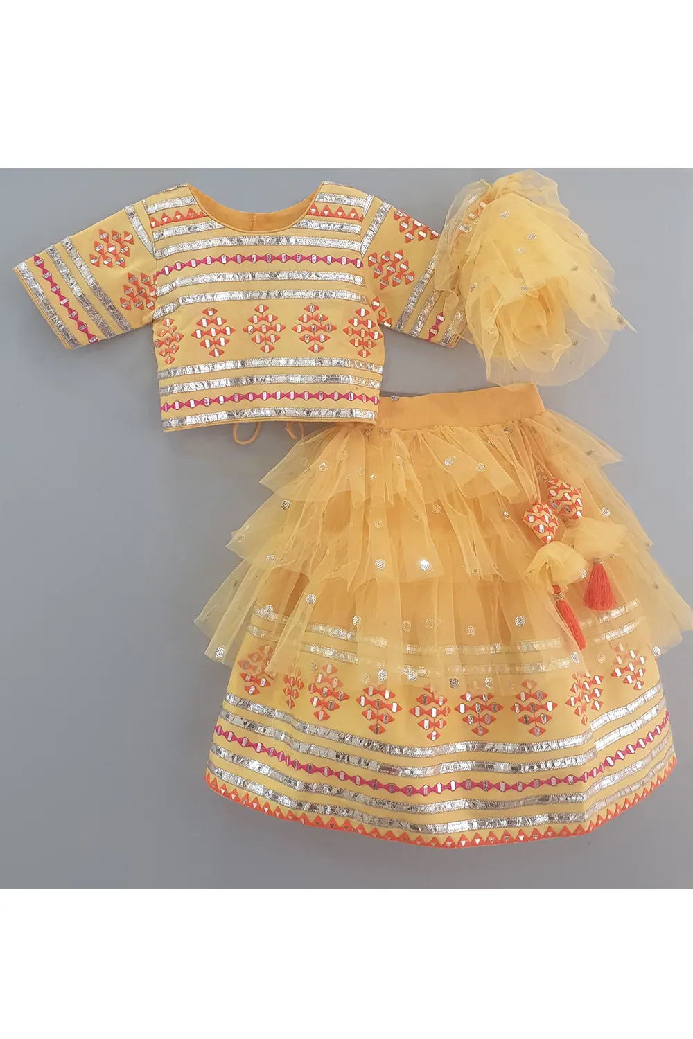 Mango yellow embroidered choli and lehenga with frilly dupatta